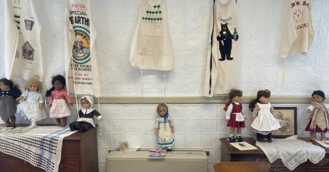 American Girl Dolls with their aprons